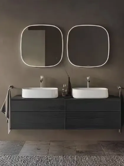 A sleek and modern bathroom with a floating double vanity in dark wood. The twin squared mirrors with rounded corners and white vessel sinks create a clean, symmetrical look.