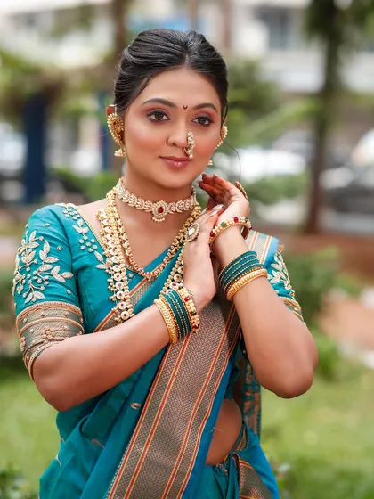 A candid moment showing the bride's confidence. The makeup is set to last through all the smiles and emotions of the big day.