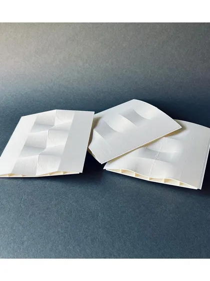 These 3D-printed iterations explore different roof forms for a project. Model making allows us to quickly test and refine complex geometries before construction.