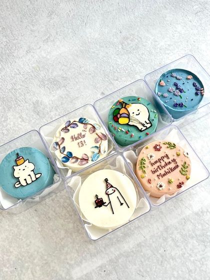 A custom set of six mini bento cakes for a 13th birthday, each with a unique design.