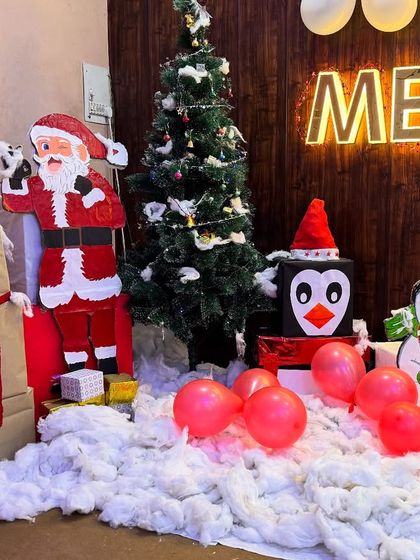 The complete Christmas setup, featuring a winking Santa, a friendly reindeer, and a cheerful snowman, all created by our talented art team.