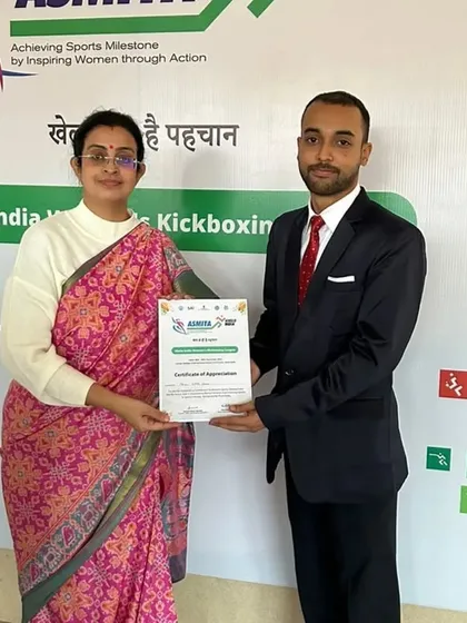 Receiving a certificate of appreciation for my contribution to the event.