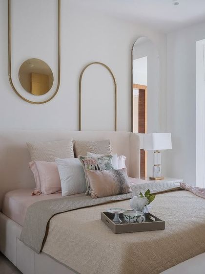 A beautifully appointed bedroom showcasing our signature style of quiet luxury. This space combines layered textures, a soothing color palette, and bespoke furniture to create a personal sanctuary for rest and relaxation.