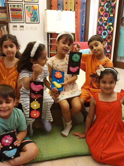 A happy group of my youngest students showing off the wall hangings they created. These projects give them a wonderful sense of accomplishment.