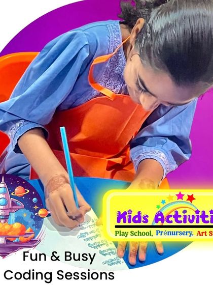 A student is deeply engaged in her work during one of our busy sessions. We nurture happy, creative minds by providing expert guidance and the freedom to explore various art forms.