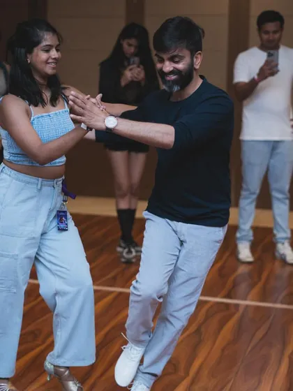 A happy moment between a lead and follow during a workshop practice session. This is what it's all about.