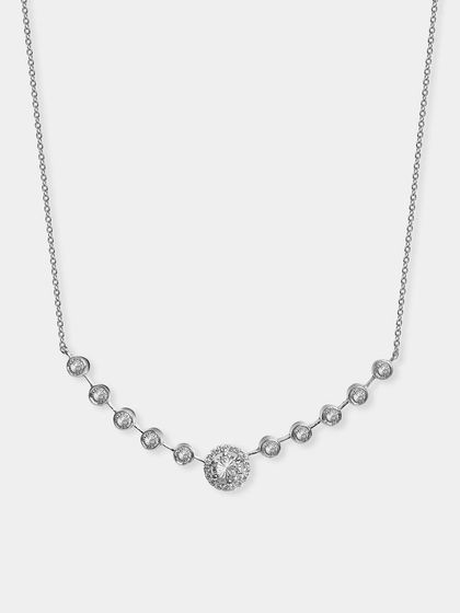 A silver necklace with a station design of bezel-set crystals. This image clearly shows the entire design of the necklace as it would sit on the neck.