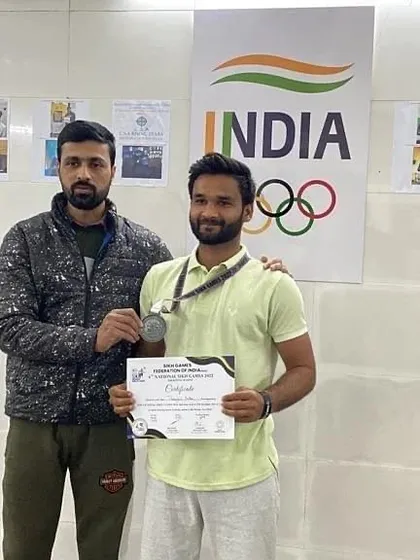 Another student, Pranjal, receiving his certificate and medal. I make it a point to personally congratulate each of my successful athletes.