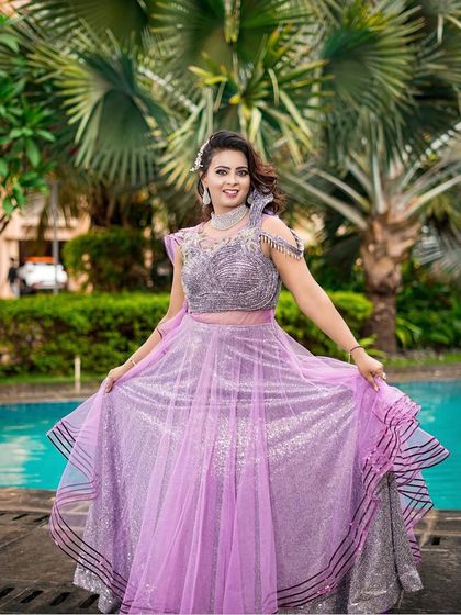 A full view of this twirl-worthy lavender gown. The layers of sparkling fabric make it a fun and glamorous choice for any celebration.