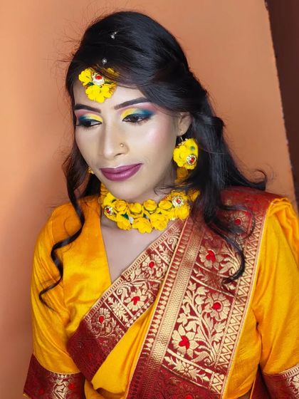 The final look, showing the bright eye makeup and floral jewellery, perfect for a memorable Haldi function.