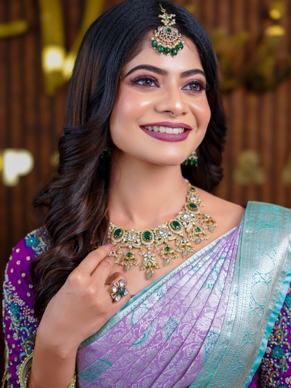 A series of photos showcasing a beautiful pastel purple and green silk saree. The soft, modern drape is perfect for a reception or pre-wedding event photoshoot.