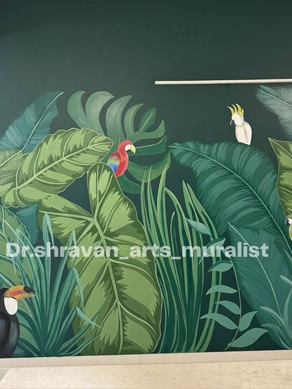 Another example of a tropical mural, this time with colorful birds like a toucan and parrots nestled among the leaves. The dark green background makes the colors of the birds pop.