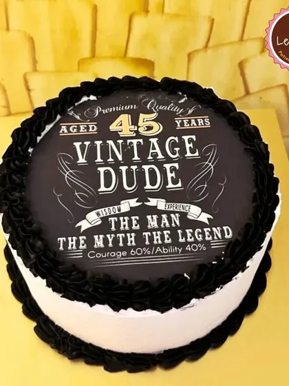A fun and stylish "Vintage Dude" cake for a 45th birthday. The edible print mimics a classic whiskey label, making it a cool and personalized option for celebrating a milestone.