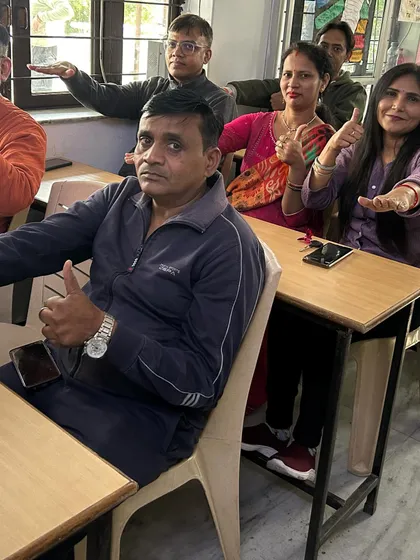 Parenting is a partnership. In my parent orientation workshops, we work together to learn practical techniques like positive affirmations and belief system changes. This image shows a group of engaged parents committed to improving their parent-child communication and creating a positive home environment.
