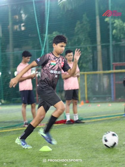 A player works on their agility and speed with the ball during a training session at NR Bhagat turf.