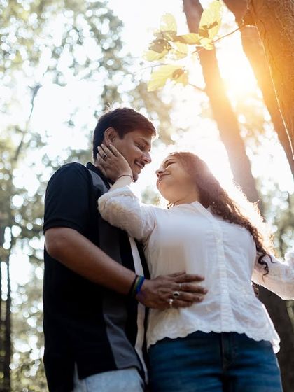 A sun-kissed moment in the woods. The low angle and the flare from the sun create a warm, romantic, and natural feel for this couple's portrait.