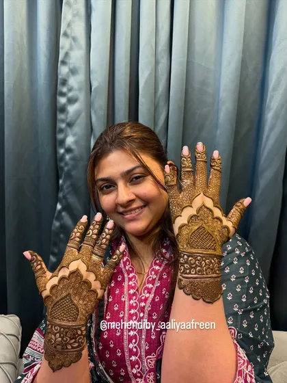 The same beautiful Pakistani design, showcased by a happy client.