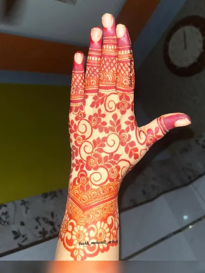 The beautiful result of using natural, chemical-free henna. This is the kind of deep red stain you can expect from my work.