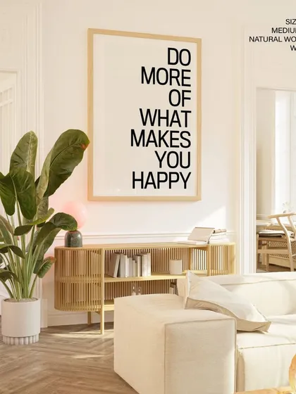 Let your walls speak with this bold typographic art. The "Do More of What Makes You Happy" quote, presented in a large format with a simple natural wood frame, serves as a daily dose of inspiration for your home or office.