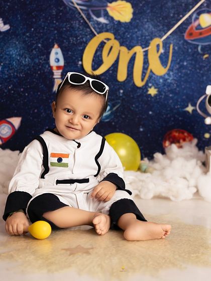 Our little astronaut is looking cool with his shades on. I love adding fun accessories to themed shoots to bring out even more personality.