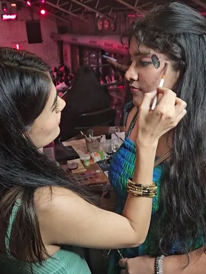 Me in my element. Here I am applying some fun, creative face paint at a live event, ensuring every detail is perfect.