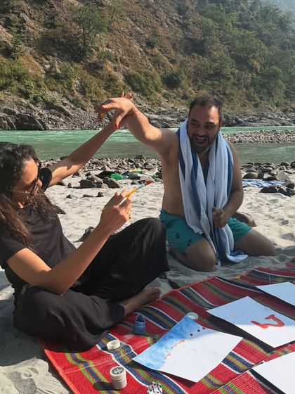 An art therapy session on the banks of the Ganga. Using watercolors to capture the flow of the river and our own creativity is a beautiful way to connect with the water element.