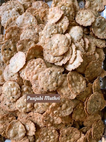 A tray full of my crispy, flaky Punjabi Mathri, a savory biscuit that is a perfect accompaniment to a cup of tea.