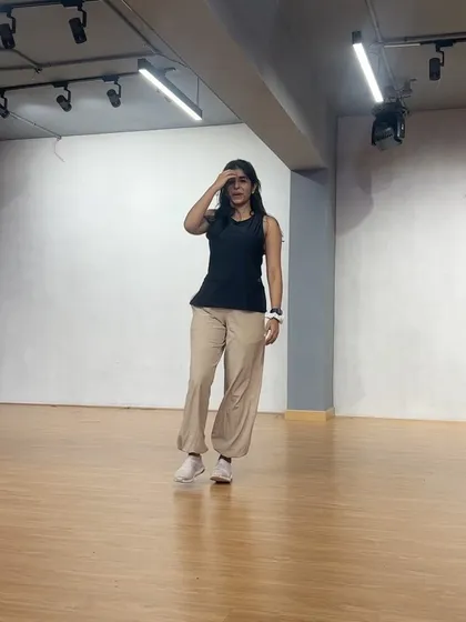 Caught in a moment of flow during a practice session. This is what it looks like to be completely lost in the movement, a core part of the expressive dance experience I share.