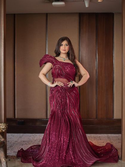 A powerful, full-length shot of the red sculpted gown. This dress is a true statement piece, perfect for making a grand entrance at your engagement or reception.