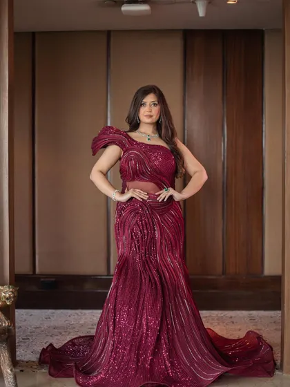 Another powerful portrait in the red sculpted gown. This dress is all about celebrating the female form with its artistic and figure-flattering design.