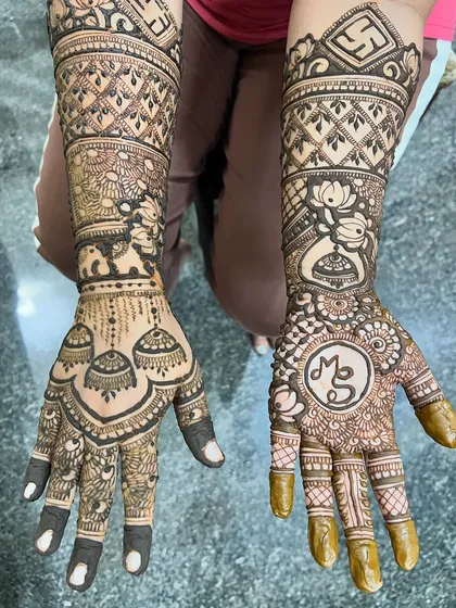 The full engagement design for Madhushree, with jhumkas, elephants, and initials.