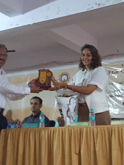 Receiving a plaque of appreciation after being a chief guest and speaker at an inter collegiate event. It is an honor to be recognized by educational institutions for my work in the field.