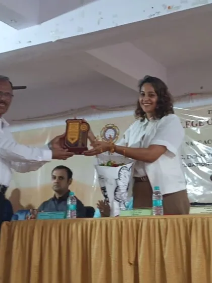 Receiving a plaque of appreciation after being a chief guest and speaker at an inter collegiate event. It is an honor to be recognized by educational institutions for my work in the field.