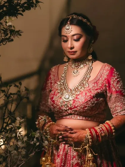 A moment of quiet contemplation. The soft, shimmering eye makeup adds a touch of glamour without being overwhelming.