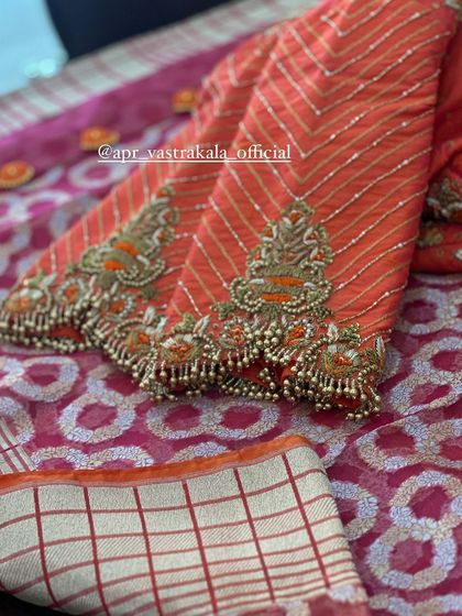 A close-up of the striped sleeves with zardosi cuffs.