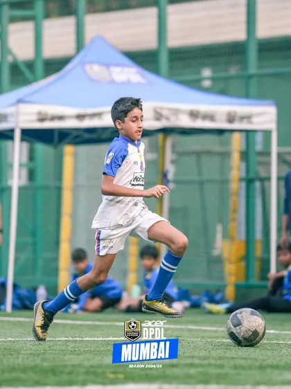 A young player on the run, showcasing agility and focus during a competitive game.