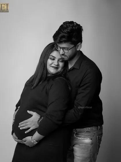 An intimate black and white couple's portrait, capturing a quiet moment of connection and love.