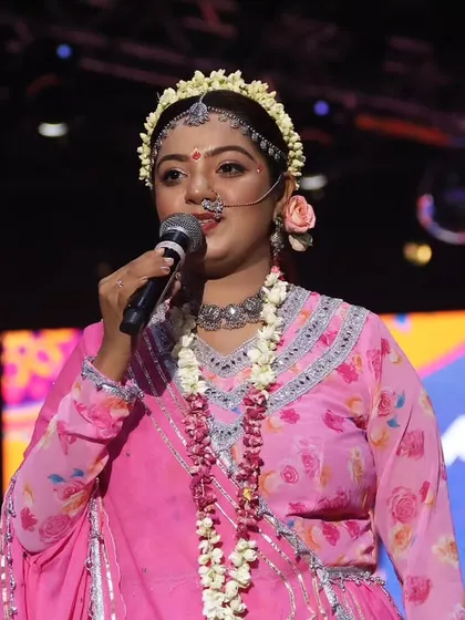 On stage as Radha, addressing the audience during the Maha-Aarti on Day 8.