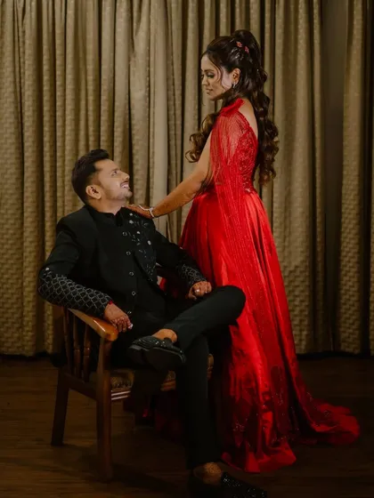 A romantic pose between the couple, showcasing the bride's beautiful side profile and hairstyle.