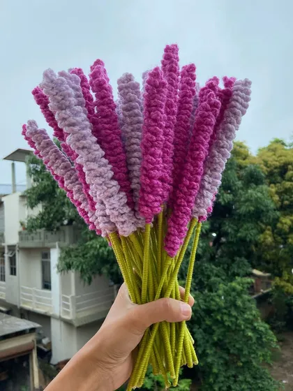A bouquet of lavender stems in two shades of purple.