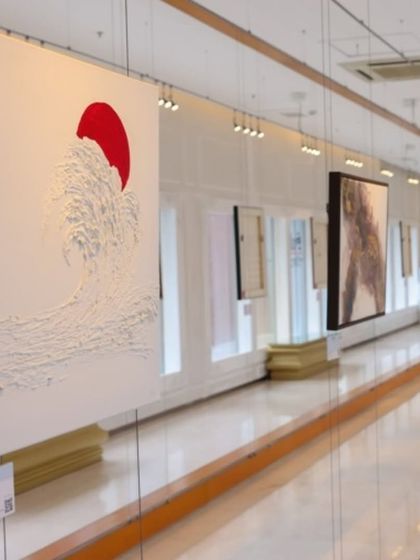 A gallery view of 'A Symphony of Colour', showing the minimalist yet powerful textured artworks.