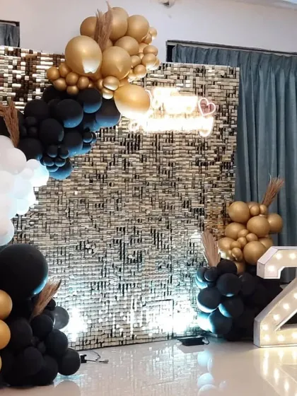 Another look at the 25th-anniversary home decor, showing the marquee numbers and the elegant combination of colors.