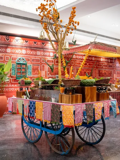 The full view of our "Back to School" cart against a colourful, hand-painted backdrop. This themed station is a complete experience, designed to transport your guests to a different time and place.