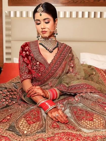 The complete bridal look, showing the elegant pose and the stunning details of the rental lehenga.