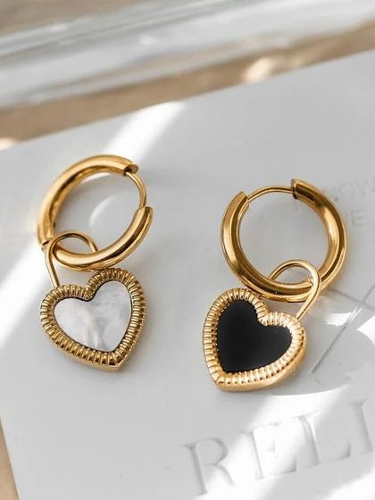 My reversible heart charm hoop earrings, with white mother-of-pearl on one side and black enamel on the other. Two looks in one.