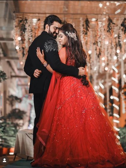 A loving embrace, with the groom looking sharp in his bespoke black suit. We are honored to be a part of such special moments.