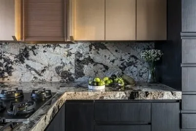 Welcome to a realm of culinary excellence. This kitchen features the sun-kissed glow of rose gold cabinetry dancing in harmony with the timeless elegance of exquisite marble countertops.