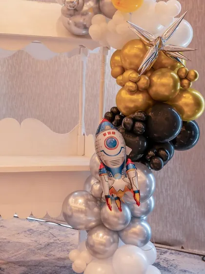 A rocket ship balloon arrangement, part of the decor for the outer-space themed birthday party.