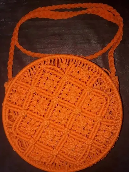 For those who want something a little different, I also make these Macrame Ring Bags. This one in bright orange has a unique circular design and intricate knotting, making it a real statement piece for any occasion.
