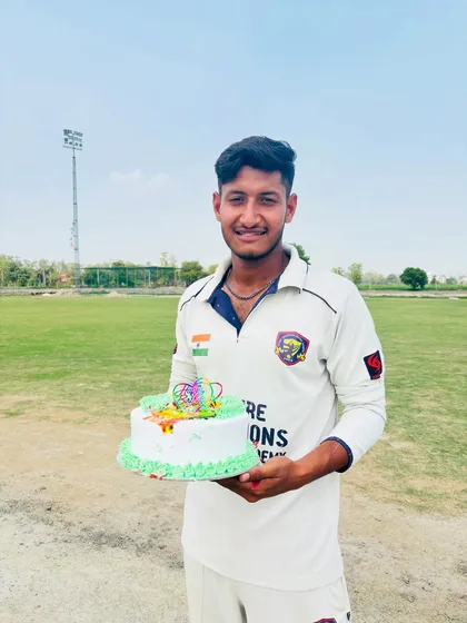 The birthday boy, Sunny, with his cake. A happy moment shared with his cricket family.